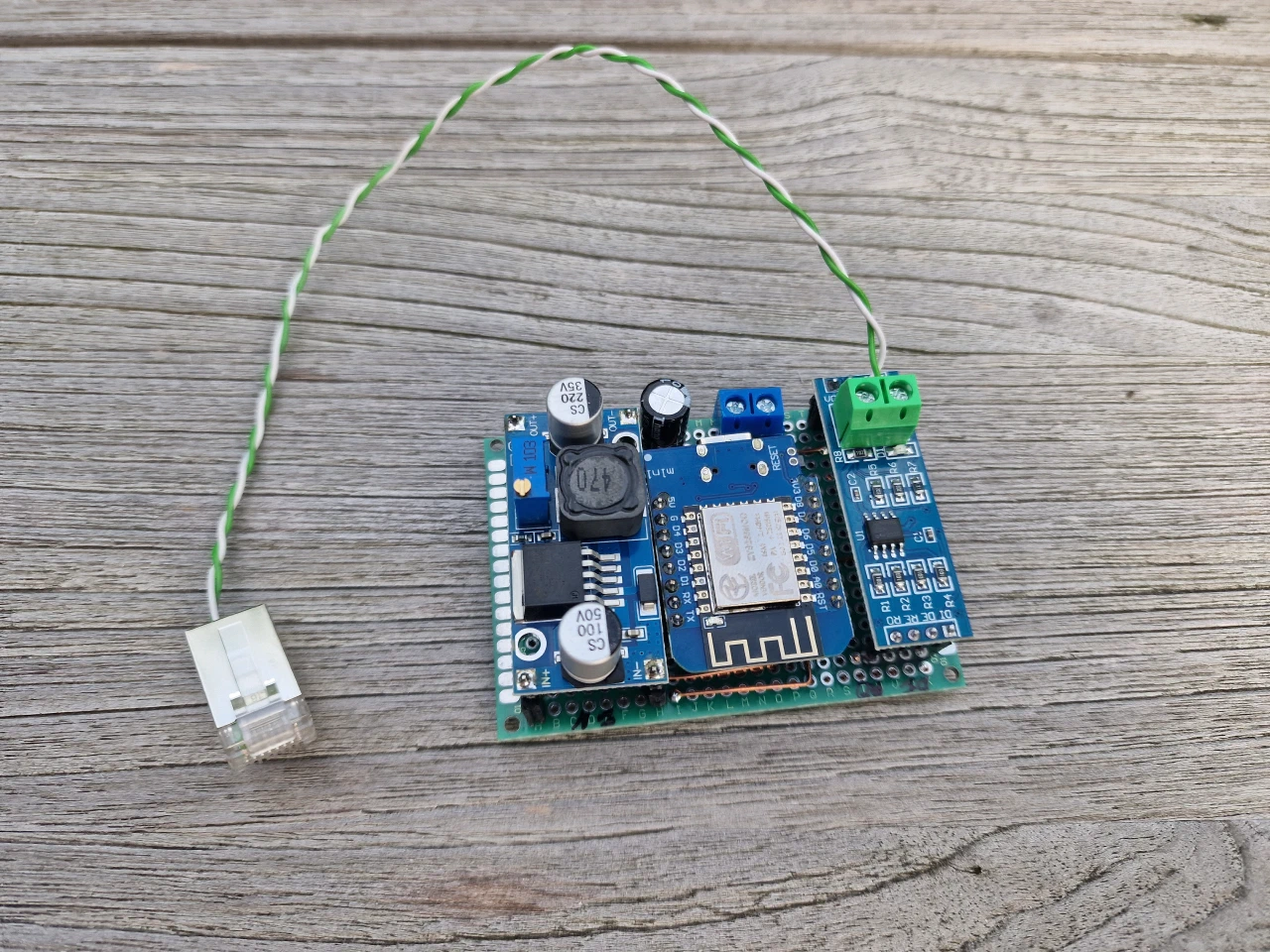 ESP8266 board soldered together with a DC to DC step down converter and a MAX485 TTL board